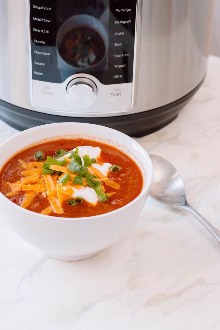 A warm bowl of chili in a crisp white bowl using the Instant Pot. Here is our very own recipe for Instant Pot Chili