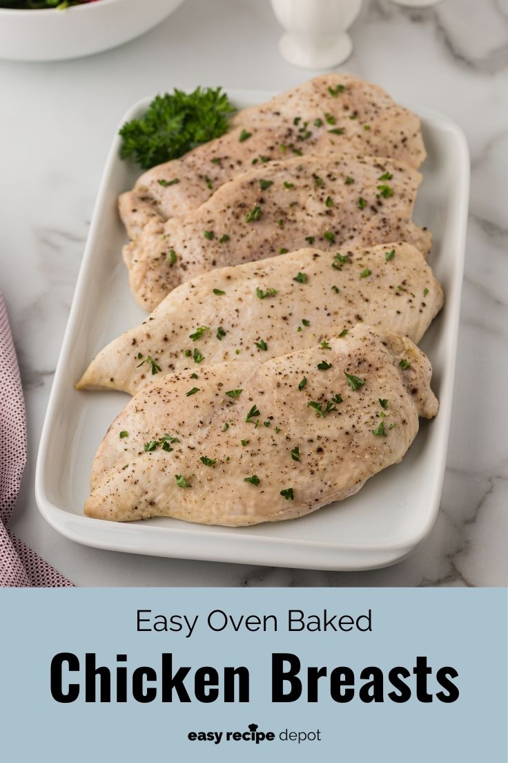 Baked boneless chicken breasts on a serving dish.