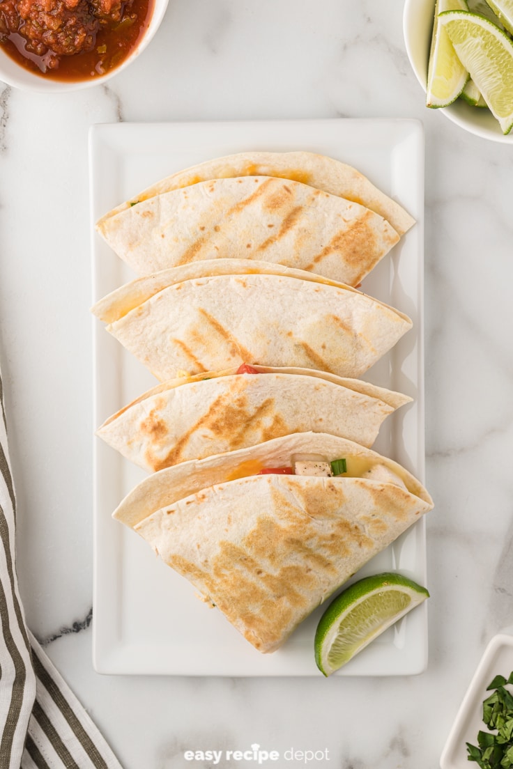 chicken quesadillas made with tomatoes and onions