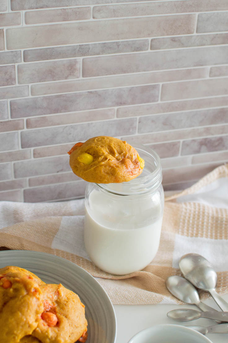 Our homemade pumpkin cookie sitting on top of a mason jar of milk