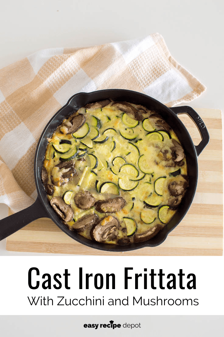Aeriel view of a vegetable frittata in a black cast iron skillet, sitting on top of a wooden cutting board