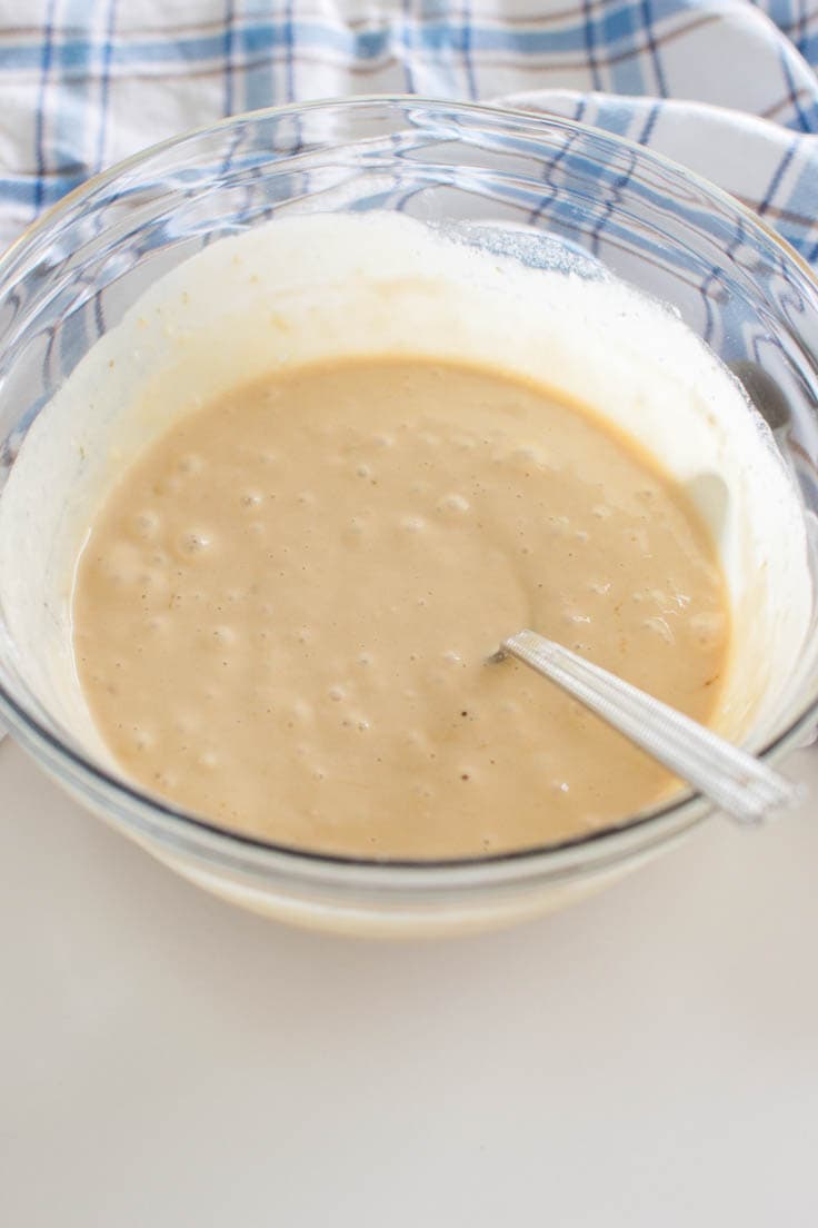 Letting brown sugar pancake batter rest in a large glass bowl
