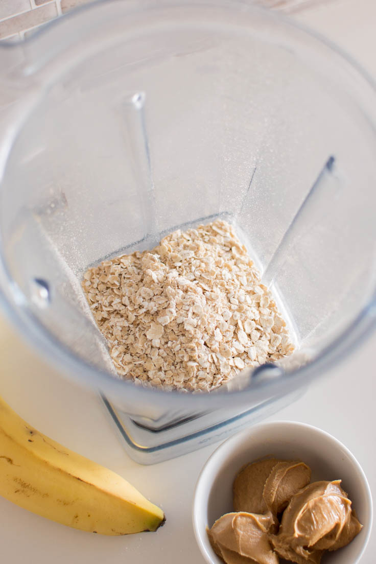 Aerial view of quick oats added into a blender