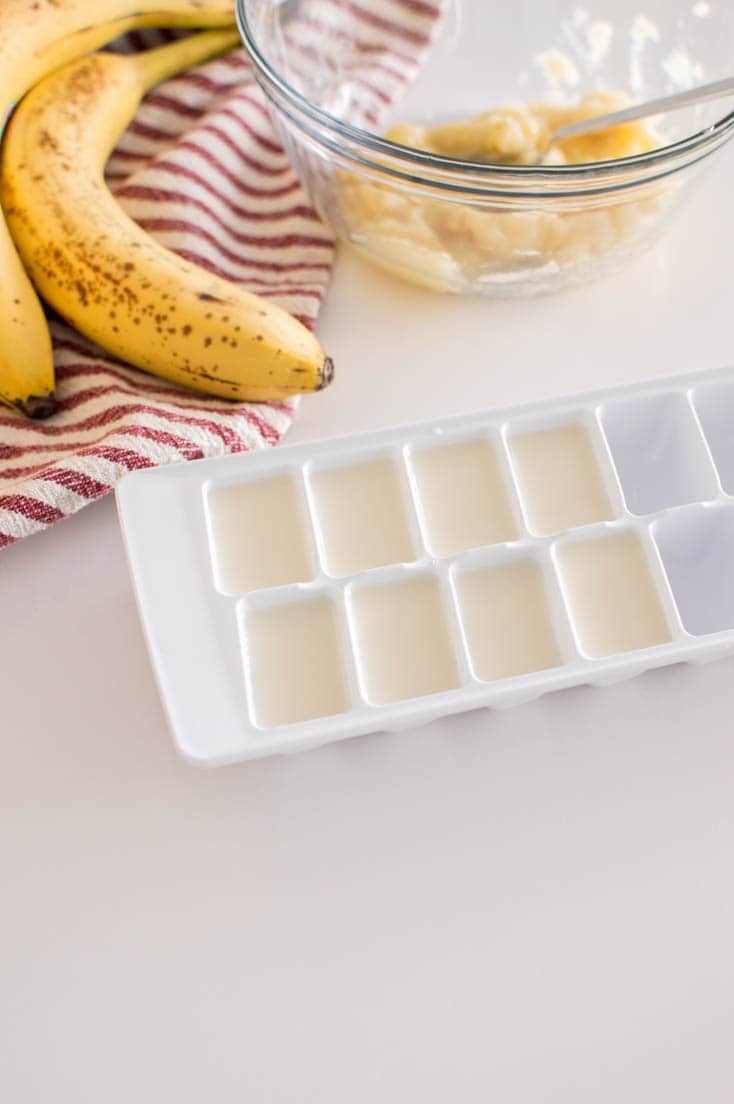 Aerial view of almond milk poured into an ice cube tray
