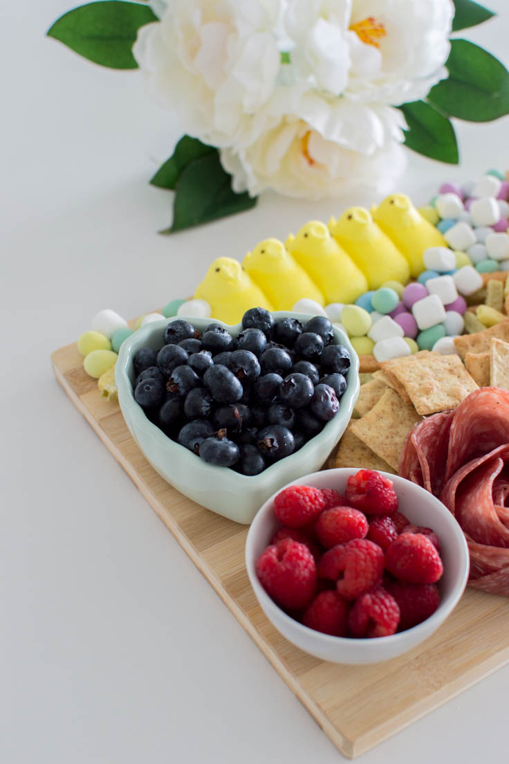 Fruits in bowls on a charcuterie board for spring