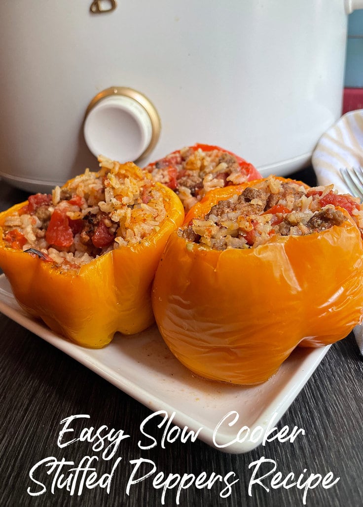 stuffed peppers on white plate in front of white slow cooker