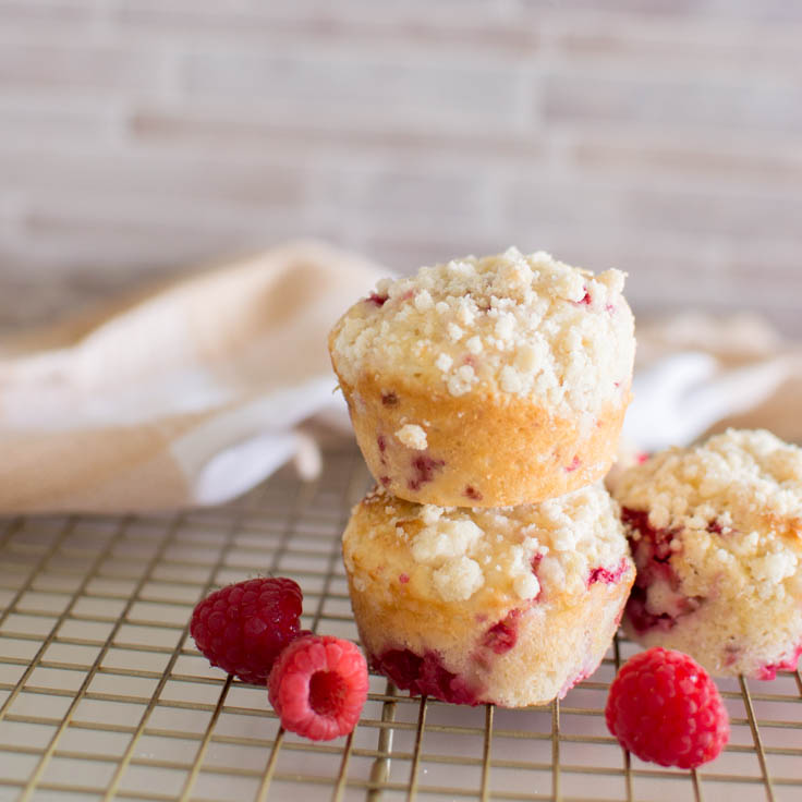 Close-up of raspberry muffins sitting on a wire rack