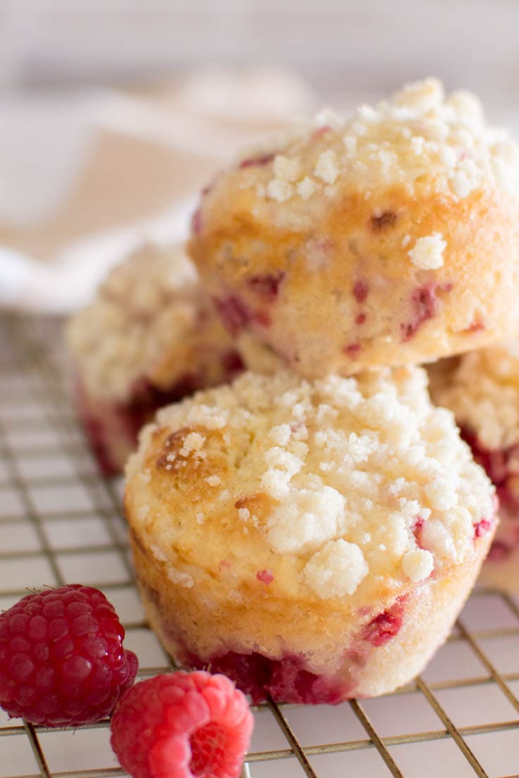 Close-up of raspberry muffins sitting on a wire rack