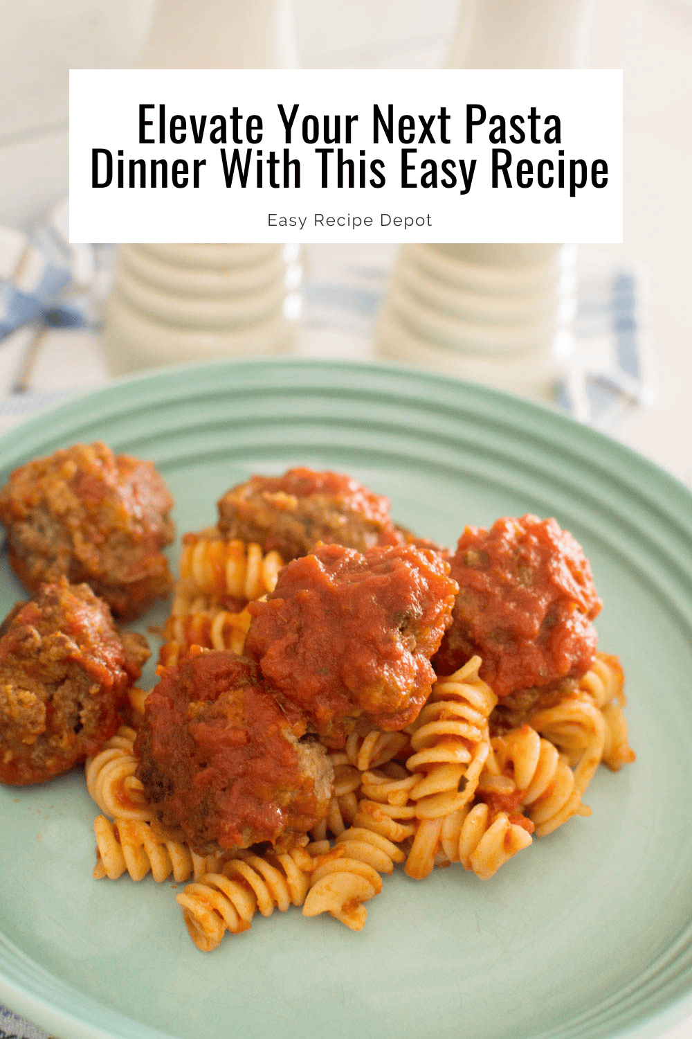 Basic homemade meatballs sitting on a bed of pasta in a turquoise pasta bowl