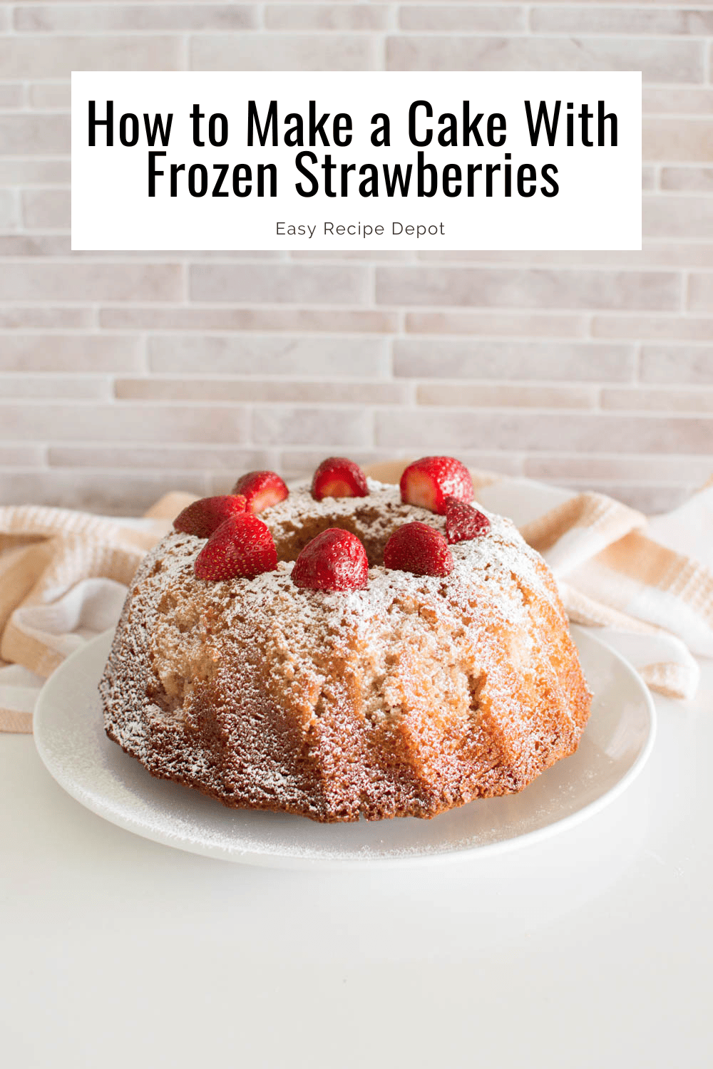 A bundt cake with powdered sugar and strawberries on top with text overlay 