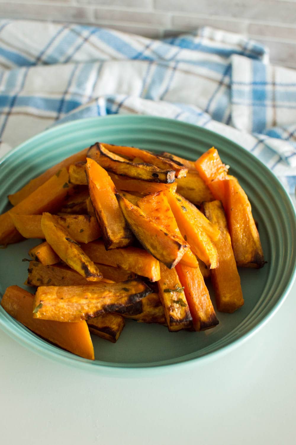 Sweet potato fries served in a green bowl