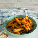 Sweet potato fries served in a green bowl