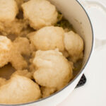 Bisquick Dumplings topped on a delicious stew, ready to be served