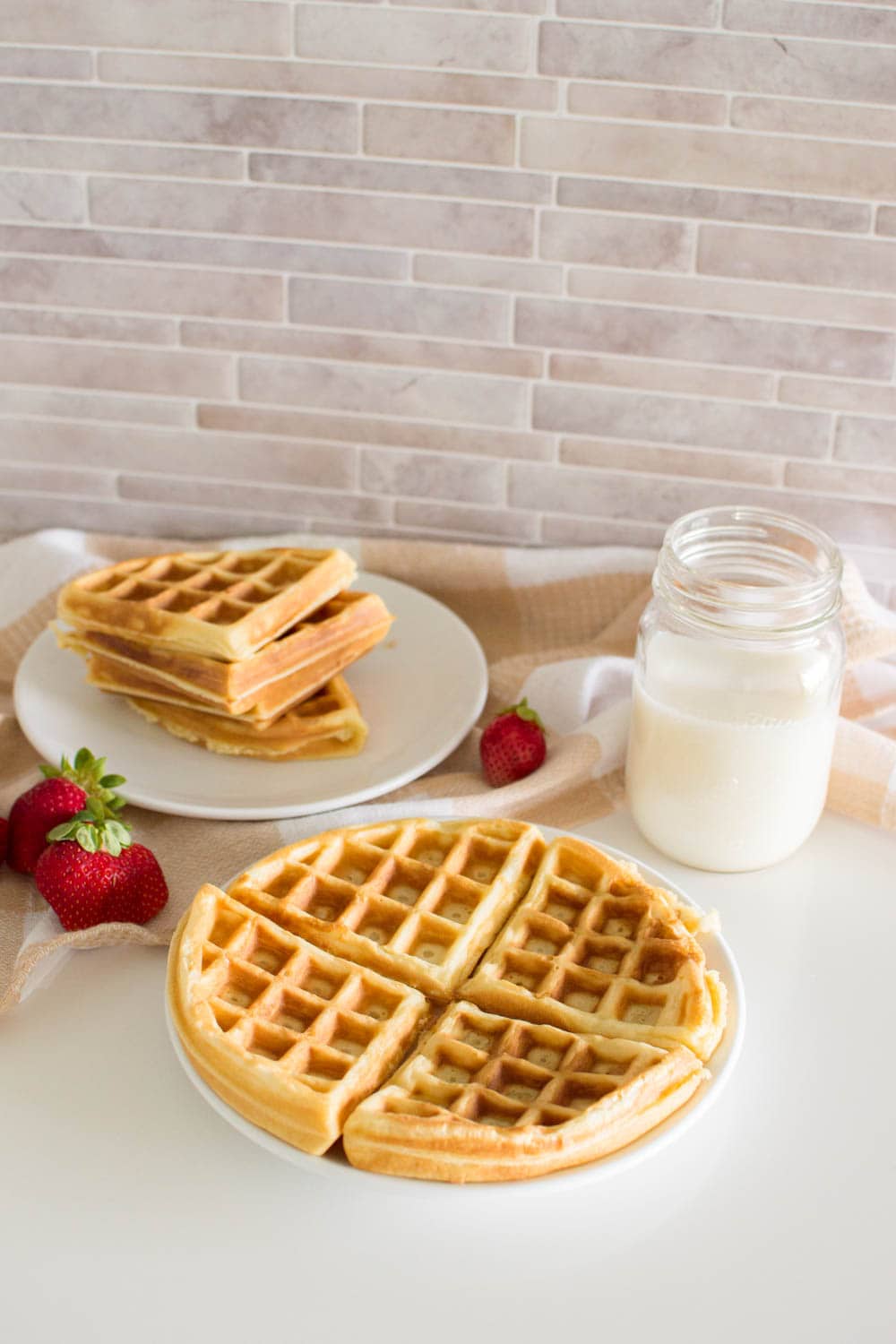 Delicious waffles prepared with our easy waffle recipe, served with milk and additional fruit