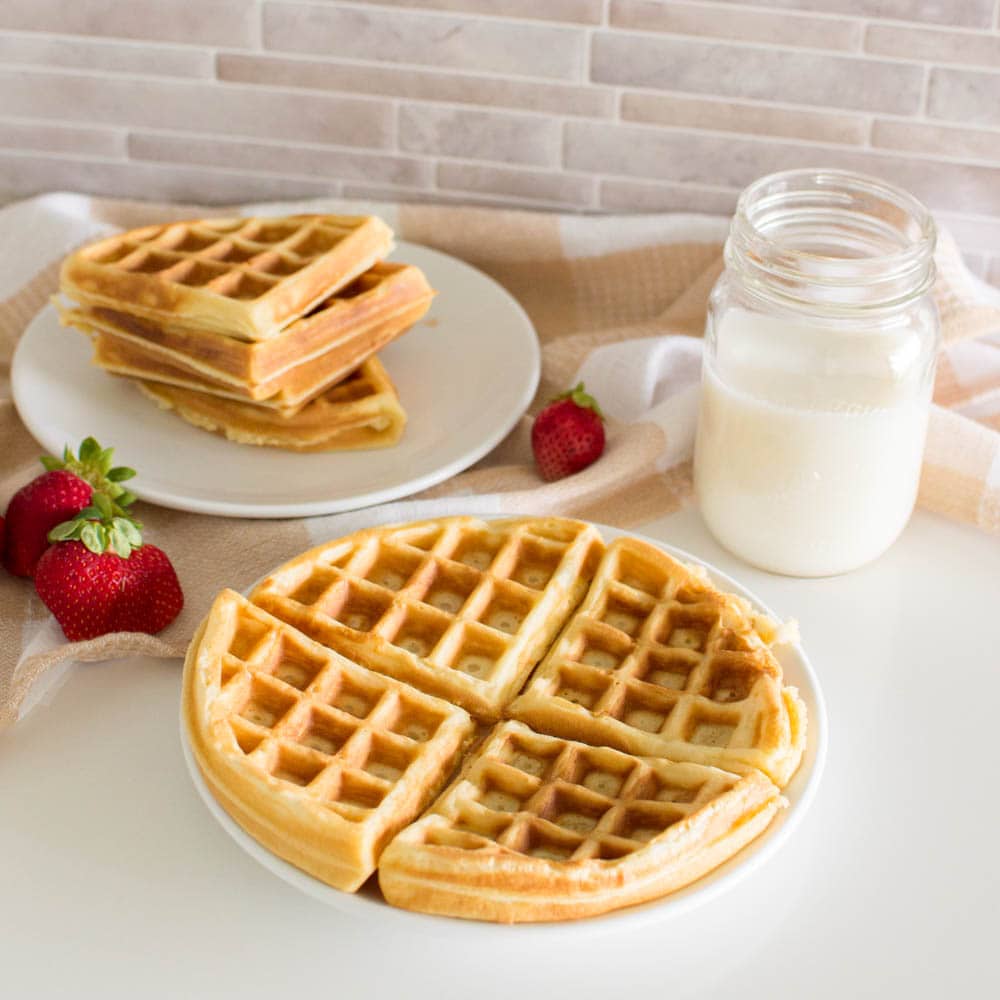 Delicious waffles prepared with our easy waffle recipe, served with milk and additional fruit