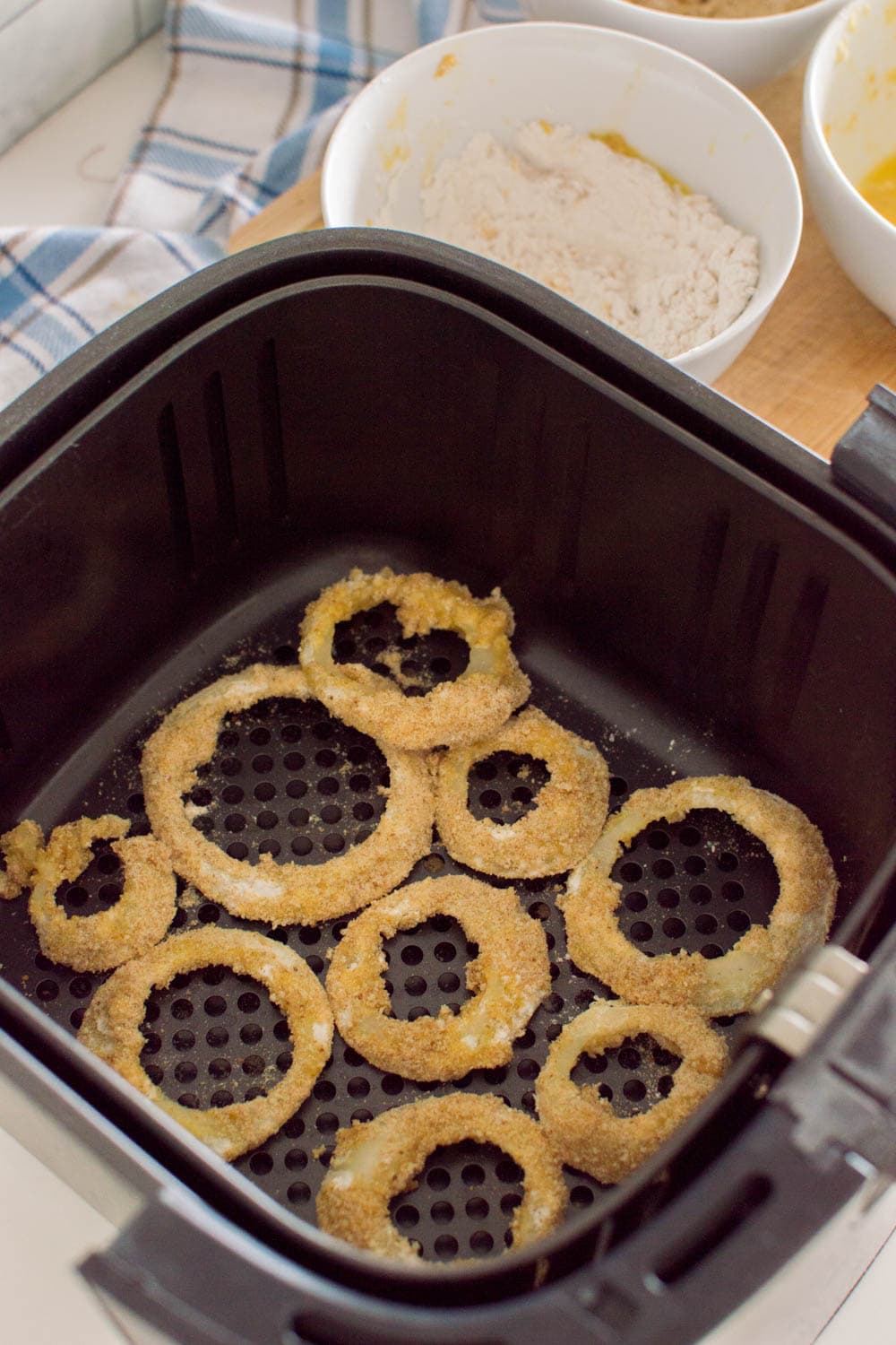 Homemade onion rings ready to be baked in the air fryer