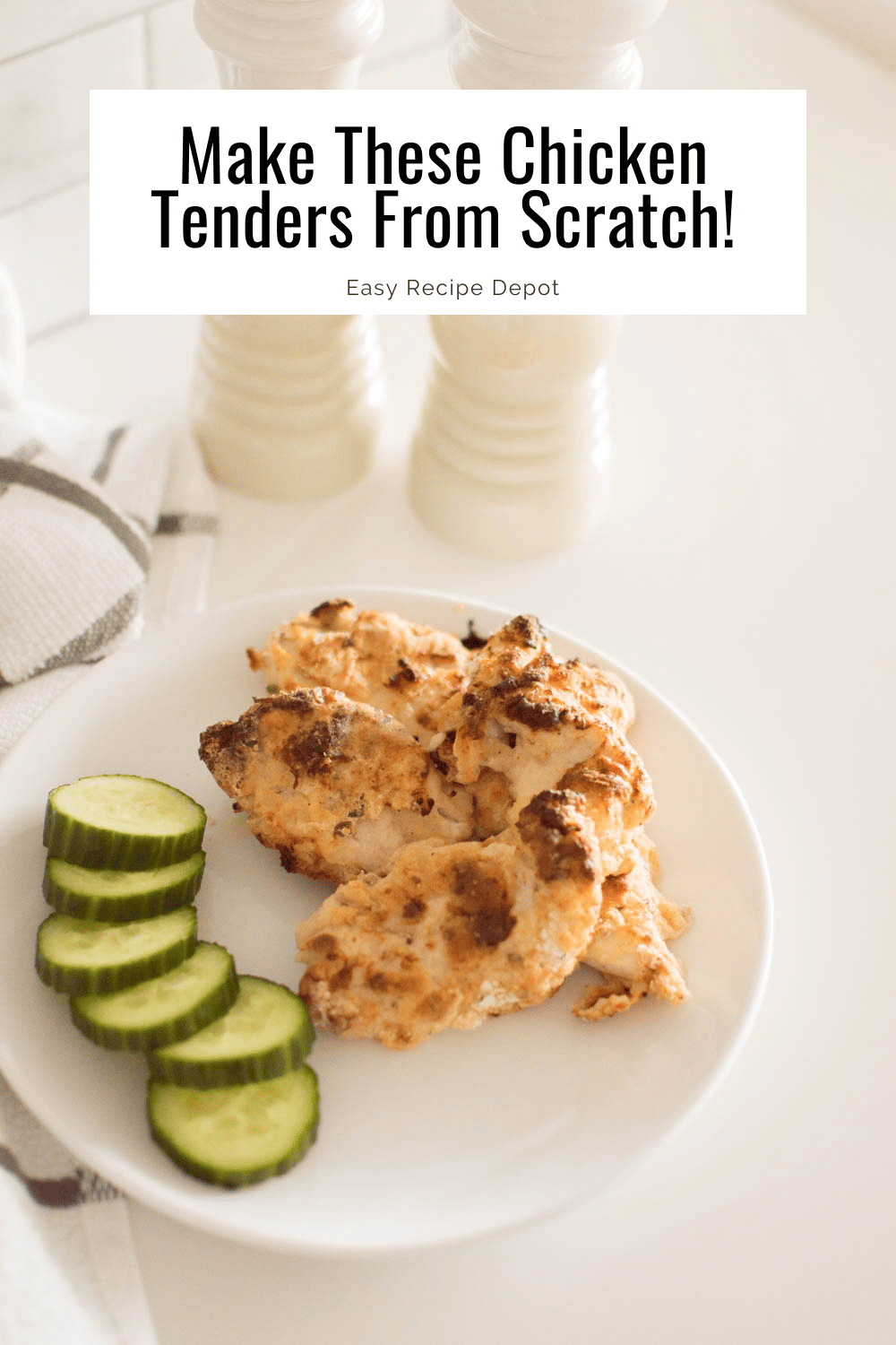 Easy chicken tenders served on a white plate with a side of cucumber